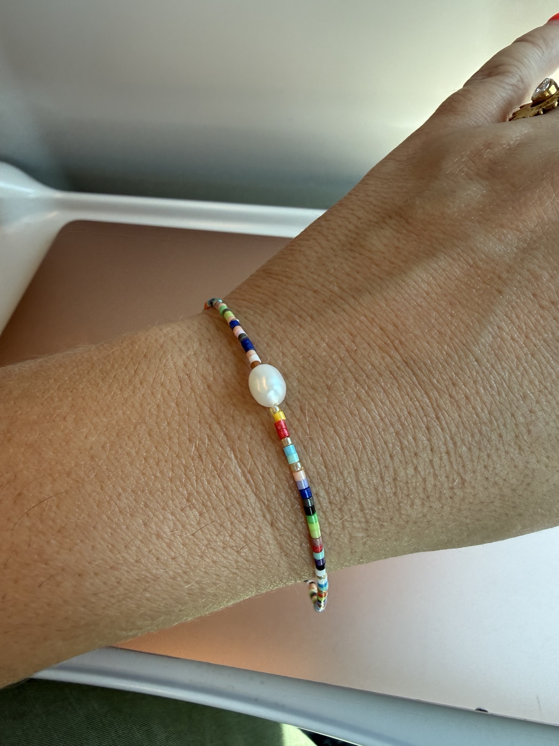 The finished Four Summers bracelet with colourful Japanese glass beads and a freshwater pearl
